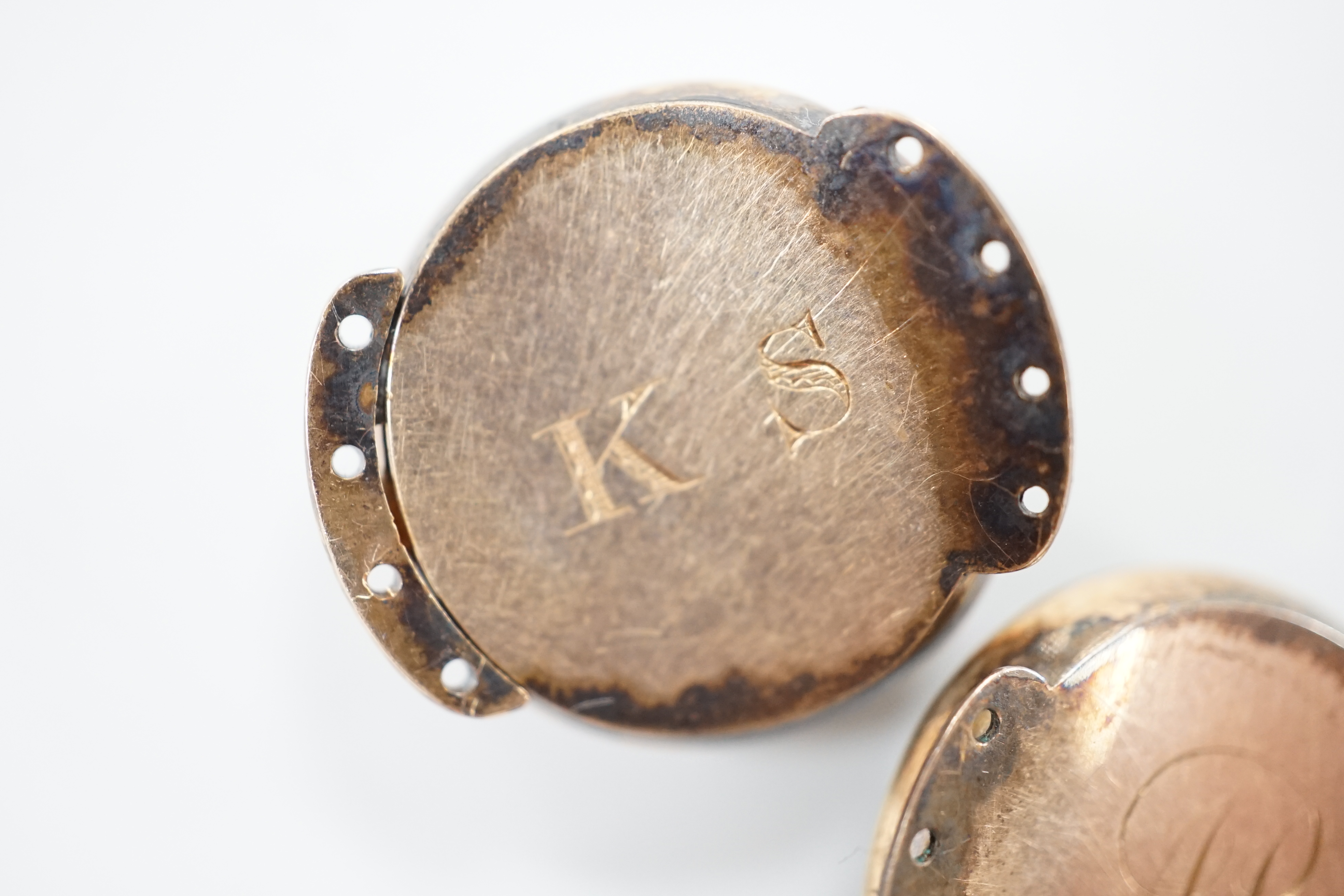 A pair of George III gold, enamel and pearl set clasps, each with differing hairwork inset and differing monogram / initials to the back, 2.25cm